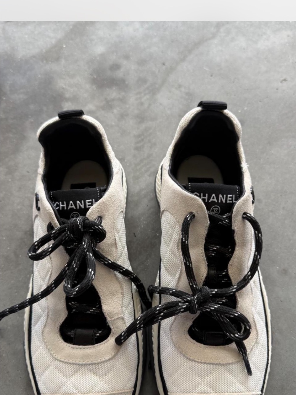 CHANEL Cream and Black Quilted Lace-Up Sneakers